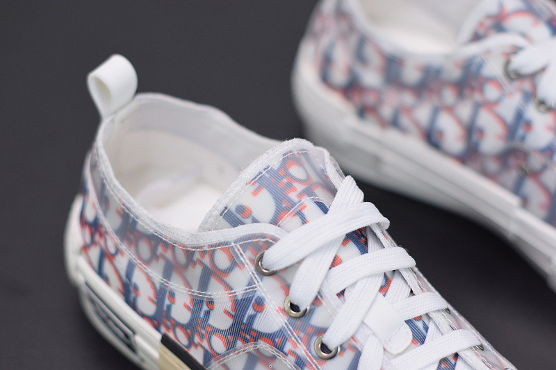 dio* b23 low-top sneaker in blue & red oblique